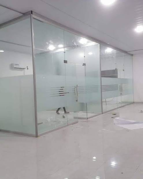 Frameless glass office partitions installed by AEIW